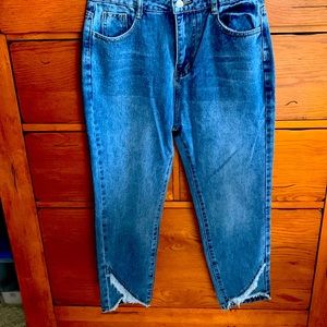 Woman’s jeans. Medium in color. Size Medium